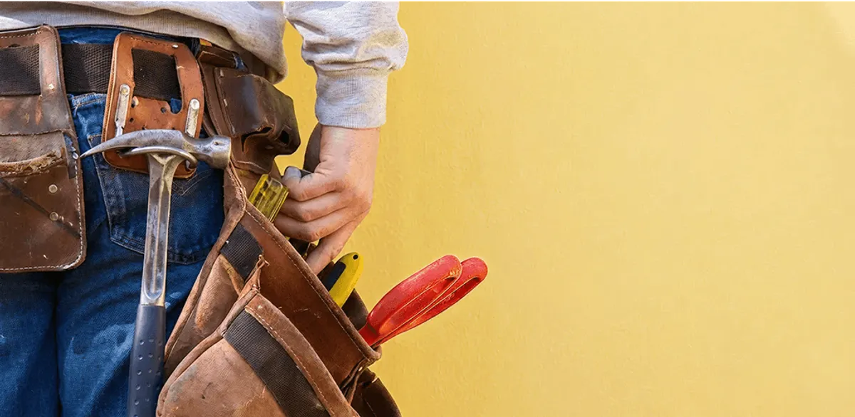 Handyman with tool belt ready for home repairs and maintenance in Scottsdale, AZ